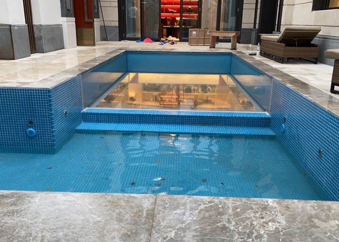 Glass-bottomed swimming pool